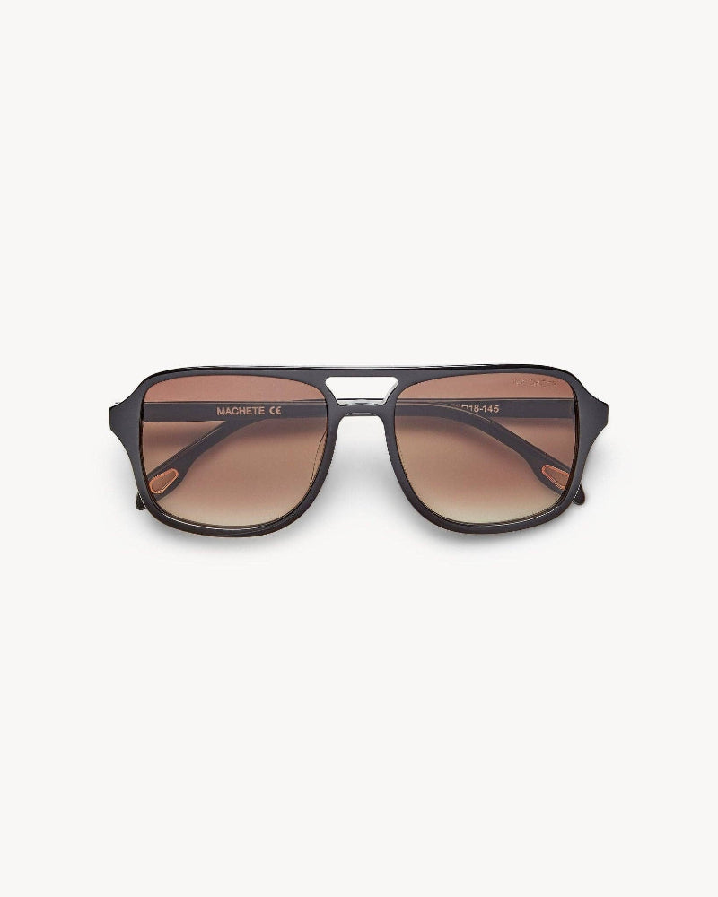 Sunglasses with brown gradient lenses on a white background