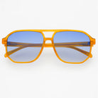 Unisex aviator sunglasses with light brown frames and blue lenses, displayed against a white background.