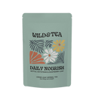 Tea package with 'Wild & Tea' branding and floral design on a white background