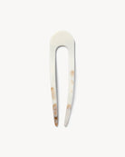 White and brown marbled hair pin with natural pattern on a white background