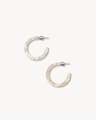 Pair of hoop earrings with a marbled design on a white background