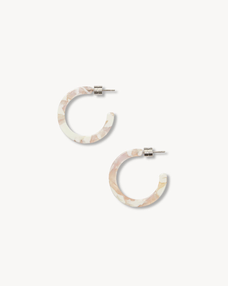 Pair of hoop earrings with a marbled design on a white background