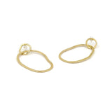large brass interlocking hoop earrings with irregular oval shape and a small circle at the top