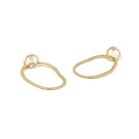 large brass interlocking hoop earrings with irregular oval shape and a small circle at the top