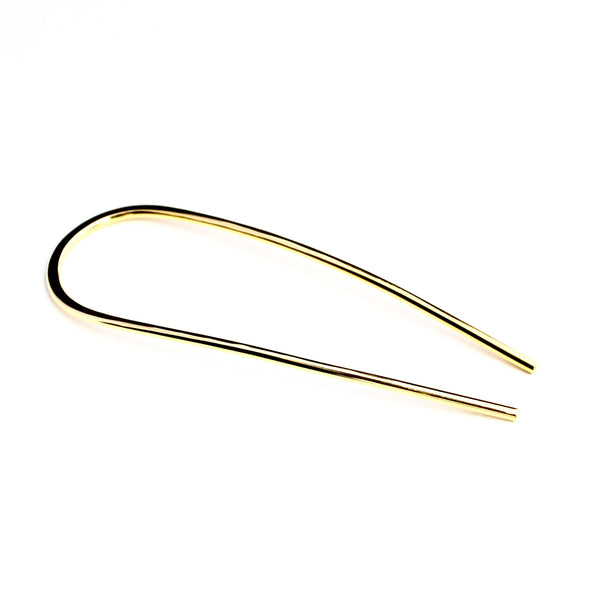 Arc hair pin made of brass with a smooth hand forged finish.